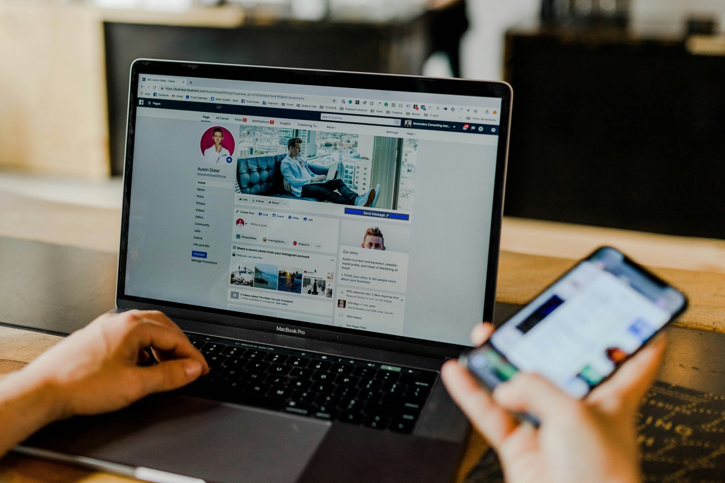 A person planning social media activity using a laptop and mobile phone