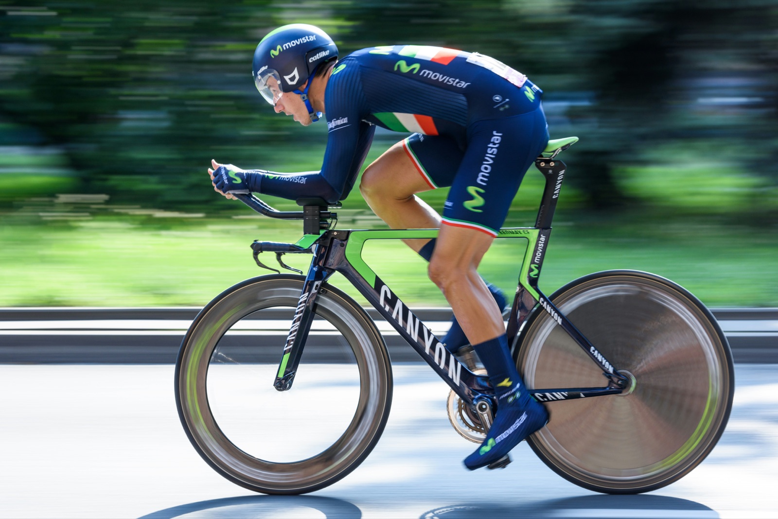 A cyclist riding at speed during a time trial race