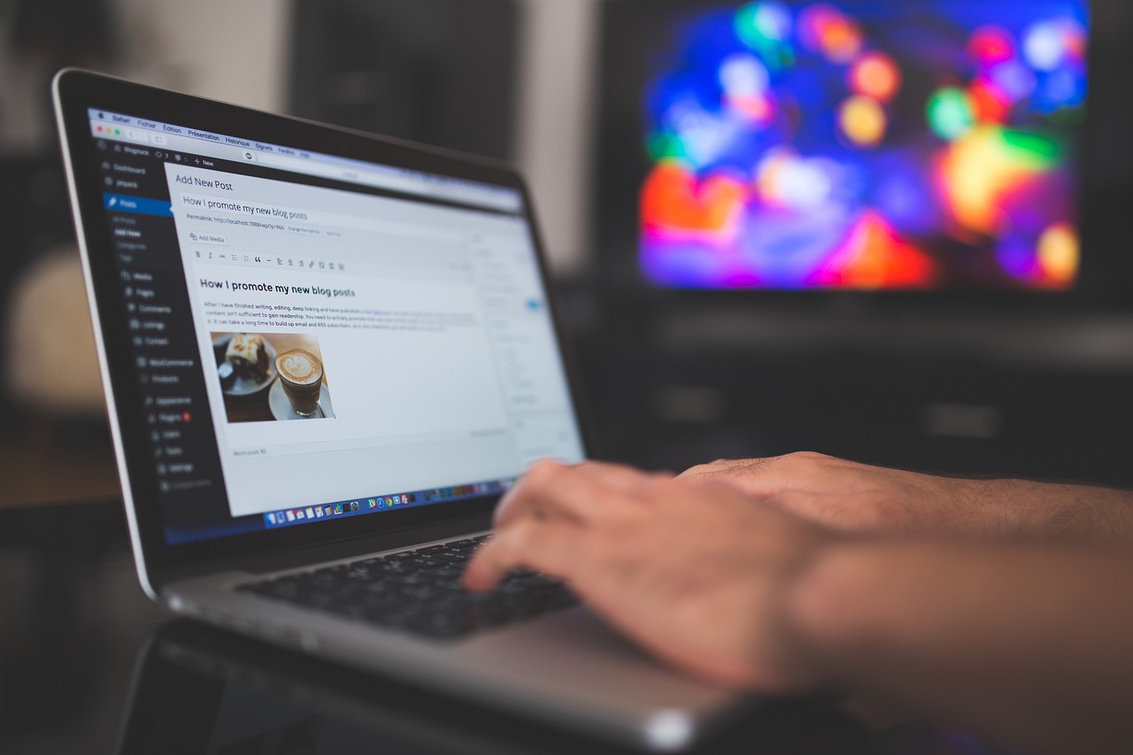 Person working on a WordPress blog using a laptop