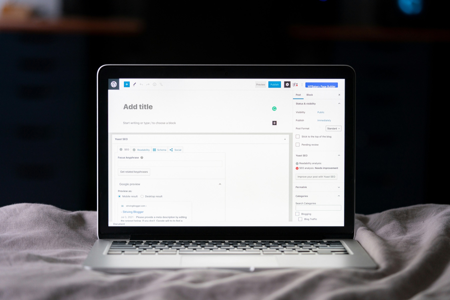 Laptop displaying the WordPress block editor and SEO settings